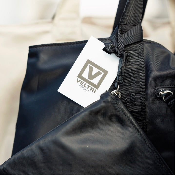 Close up of Veltri Sports Newport Tote showing the Veltri Sport Tag.
