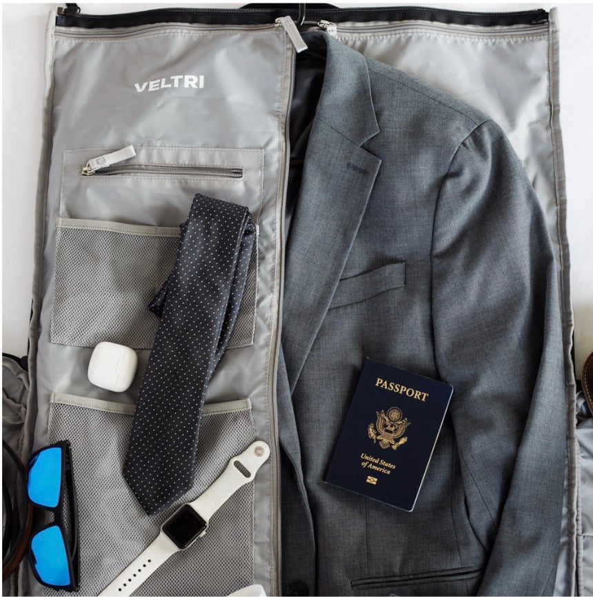Interior view of Veltri Sport Garment Duffle showing various travel and business accessories that can fit inside.