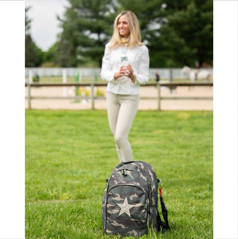 A girl holding a water bottle behind a Veltri sustainable backpack signifying that each bag is made from recycled water bottles.