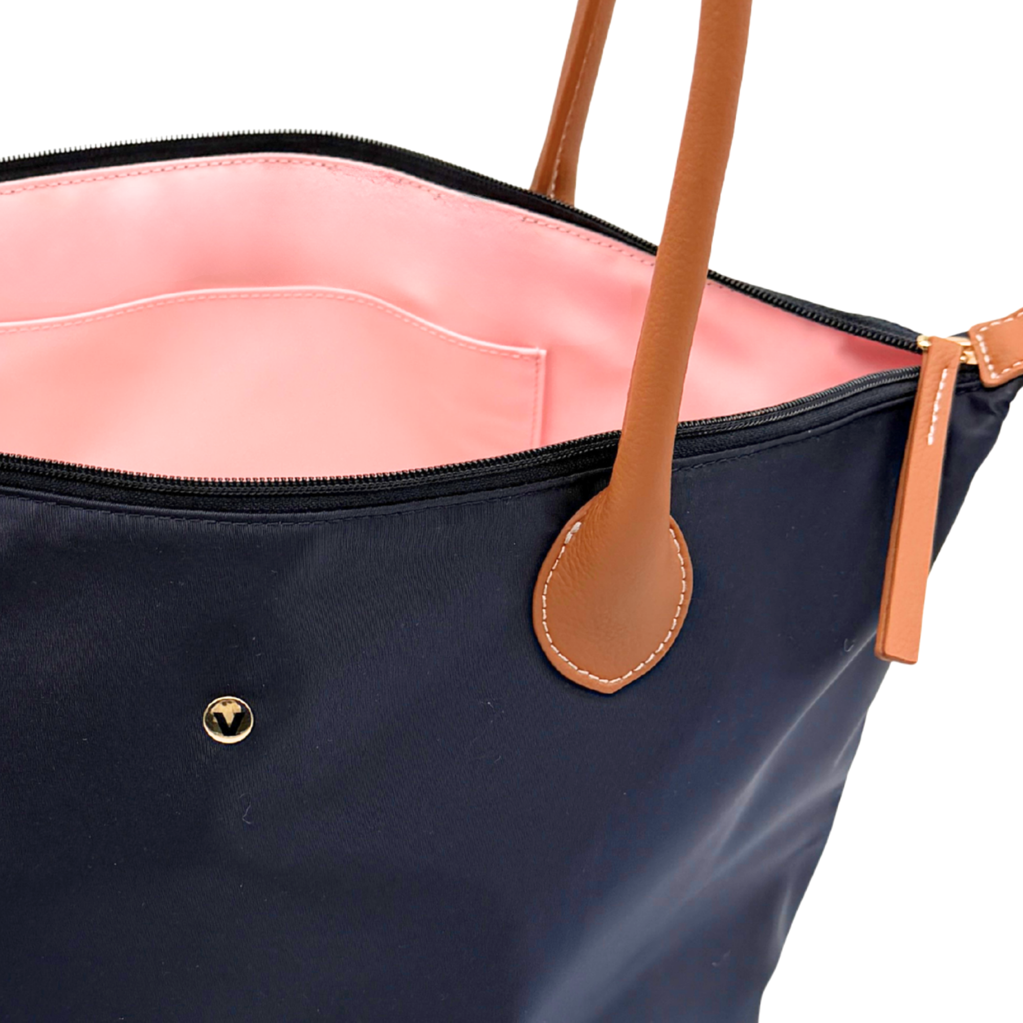Interior of Campus Tote in dark navy showing wipe-clean PVC lining in blush pink