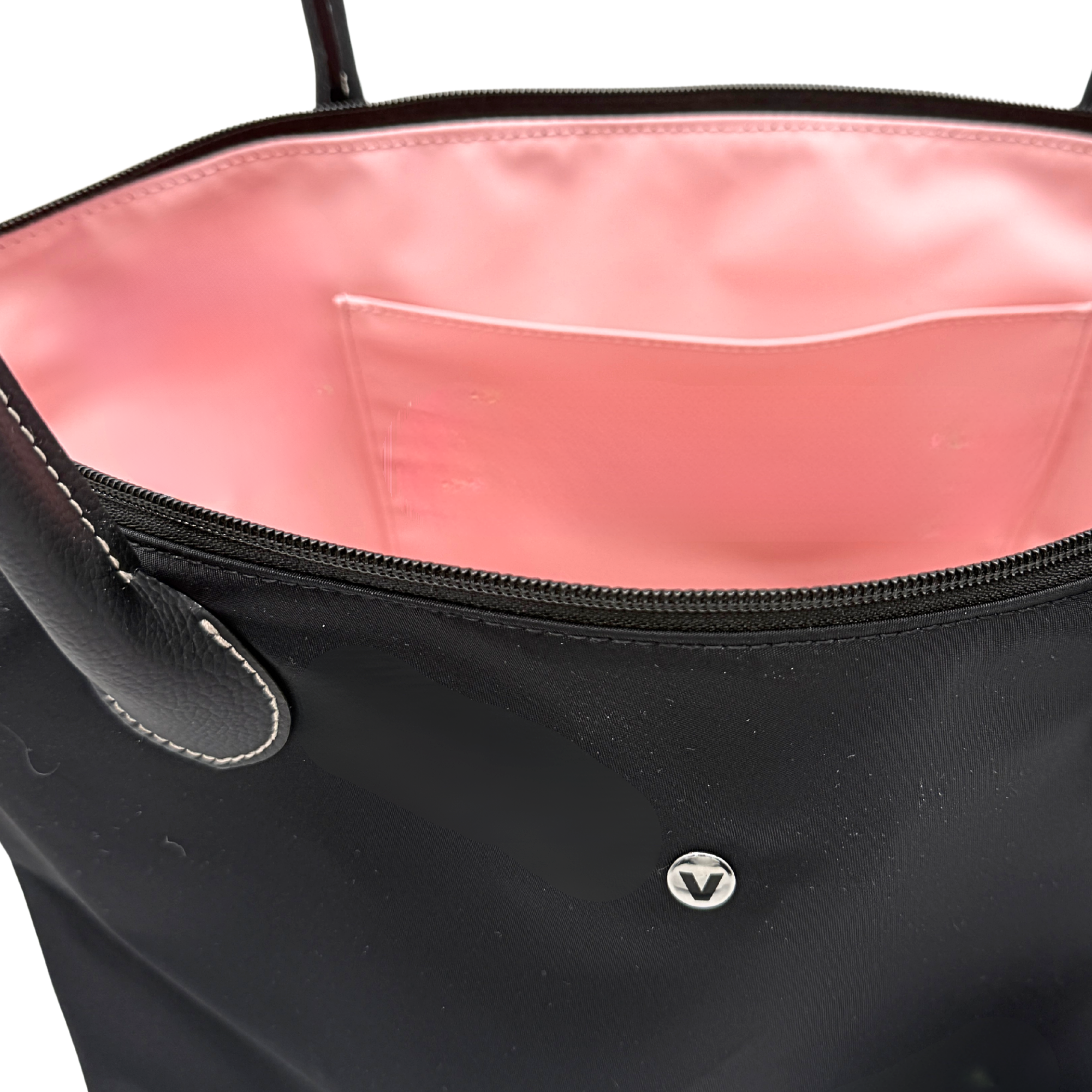Interior of Campus Tote in black showing wipe-clean PVC lining in blush pink
